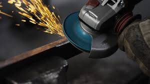 Someone is abrasing a steel plate with a grinder