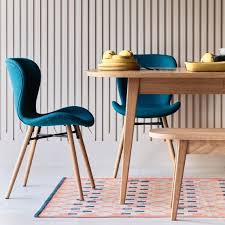 The strong, oak effect metal legs which have a nice taper detail and the seat is upholstered for added comfort. Etta Chair Teal Blue Fabric Upholstered Dining Chair With Solid Oak Legs Teal Dining Chairs Dining Chairs Uk Dining Chairs