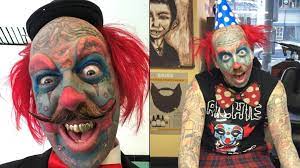 a clown with face tattoos