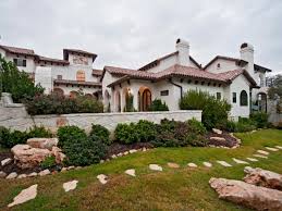 spanish style austin home with arched