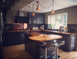 Fast dark wood worktops delivery. This Stunning Kitchen Features Vast Swathes Of Walnut Worktops Against Modern Glossy Cabinets Wood Worktop Grey Kitchen Walls Home Decor Kitchen