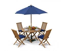 There are many coordinating pieces, including folding chairs, captain's chairs, and side tables. Suffolk Folding Round Garden Table And Chairs Set Teak Dining Set