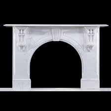 A Large Arched White Marble Fireplace