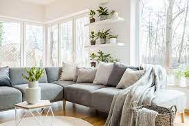 arrange cushions on a corner sofa