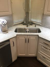 recessed corner sink cabinet with a