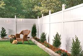 White Vinyl Fence With A Small Raised