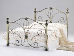 Standard double size bed frame, solid metal construction in black with lovely brass effect bolsters. Heartlands Furniture Diane Antique Brass Bed Metal Bed At Mattressman