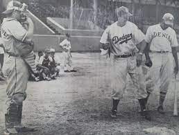 Historic photo of Brooklyn Dodgers scout Al Campanis (center) giving  batting instructions to an unknown youngster from Carolina named Roberto  Clemente. Sixto Escobar Stadium, San Juan, PR. Circa 1952. : r/Dodgers