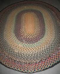 braided oval antique rug with wide