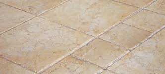 remove adhesive from ceramic tile
