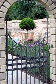 Contemporary Arched Gate Iron Garden