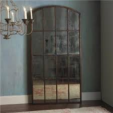 antiqued arched window leaner mirror