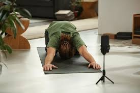 young man showing yoga exercises on the