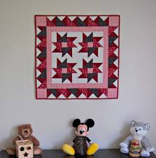 a clever way to hang a small quilt