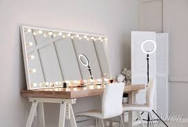 modern mirror with light bulbs on