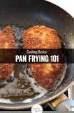 How does a frying pan heat food?