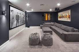 carpeted home theater with black walls
