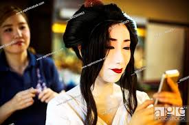 a geisha or maiko with a hair and make