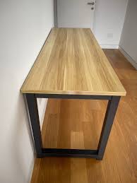 wooden table top with metal legs