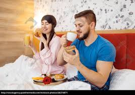 romantic couple breakfast in bed caring