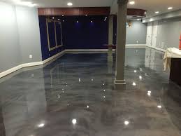 I am thinking of putting down some epoxy on my basement floor, which is currently a mishmash of old concrete. Epoxy Basement Floor Cost Concrete Basement Floors Metallic Epoxy Floor Epoxy Floor Basement