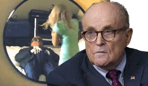 Rudy giuliani flat on a hotel bed, hands down his pants, while a. Rudy Giuliani Caught During Hotel Room Interview With Borat S Daughter