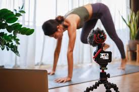 woman yoga teacher filming cl