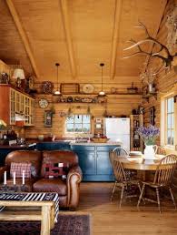 This log cabin is very much a vacation home fit for entertaining guests and reuniting with family. Small Cozy Cabin Pictures Cozy Kitchen Small Cabin Living Log Cabin Interior Log Cabin Kitchens Cabin Interiors