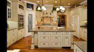 The wood used in the cabinets throughout the kitchen was distressed to match the reclaimed stone and marble. Antique Cream Colored Kitchen Cabinets Youtube