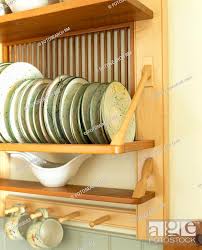 Close Up Of Plates On Wooden Plate Rack