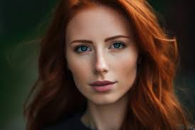 stunning redhead woman with green eyes