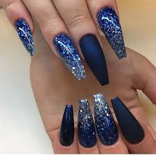 Glossy navy blue and speckled stars on the tip of your hands will have your nails in ship shape in no time! Navy Blue Nail Ideas You May Not Have Tried Blue Glitter Nails Blue Coffin Nails Blue Nails