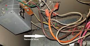 When working with a thermostat the cover can be snapped off to expose the wiring. Old Furnace With No C Terminal For Wifi Thermostat Home Improvement Stack Exchange