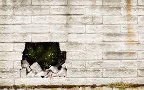 Big Hole In A Cinder Block Wall