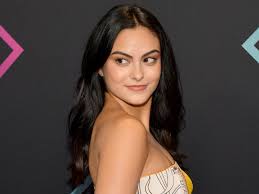 camila mendes blends makeup with a