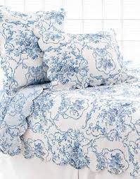 blue and white bedding with scalloped