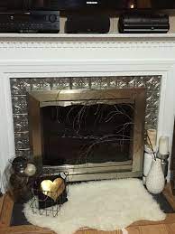 Faux Metal Tiles Around Fireplace