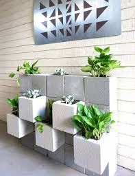 a diy cinder block succulent wall with