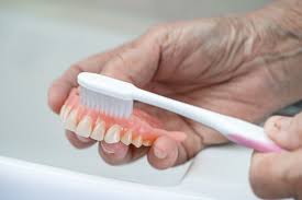 how to remove denture adhesive