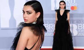 Born in cambridge as charlotte emma aitchison, charli xcx is a singer, songwriter, model and actress. Brits 2020 Charli Xcx Oozes Gothic Chic In A Black Tulle Gown Daily Mail Online
