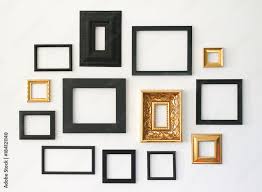 Picture Frames On White Wall Stock