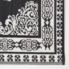 white motif design reversible outdoor rug