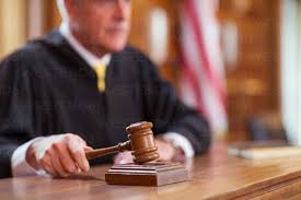 judge banging gavel in court stock photo