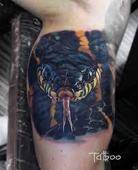 Red sword and snake tattoo. 38 Realistic Snake Tattoos