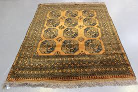 a golden afghan rug mid 20th century