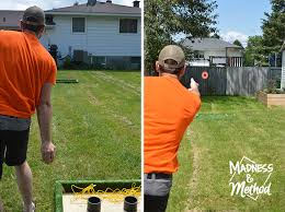 Washer toss has many names, but whatever you call it, the popular yard game is perfect for passing the time at outdoor gatherings. Washer Toss Game Diy Madness Method