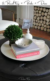 Put elements of your coffee table decor into a bowl, under a cloche, in a box, basket or unique container. How To Style A Round Coffee Table Decor Fix