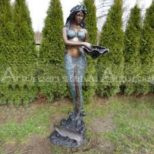 mermaid bronze fountain holding a