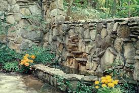 Rock Wall Build As Fountain And Pool In