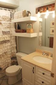 bathroom with over the toilet shelves